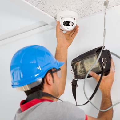 Technician Installing Security Camera